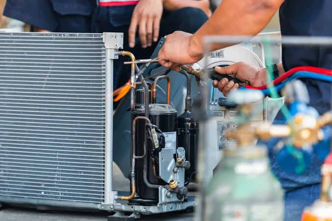 Close-up emergency repair work on an air conditioning system